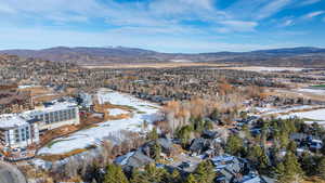 Snowy aerial view with a mountain view