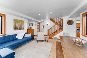 Living room with light hardwood / wood-style flooring