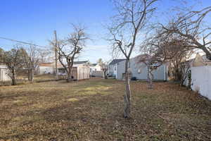 View of yard featuring a storage shed