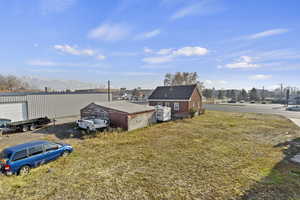 View of yard with a mountain view and an outdoor structure