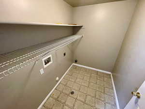 Clothes washing area featuring washer hookup and electric dryer hookup