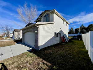 View of property exterior with a garage