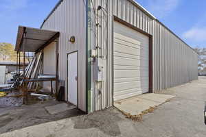 View of outbuilding with a garage