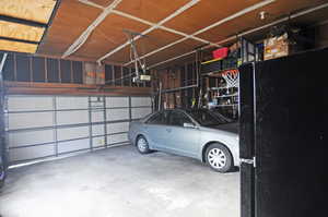 Garage featuring a garage door opener