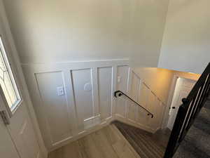 Stairs with hardwood / wood-style flooring