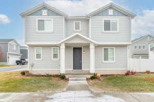 View of front facade with a front lawn