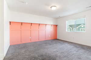 Unfurnished bedroom with carpet floors and a closet