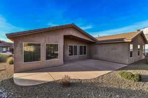 Rear view of house featuring a patio