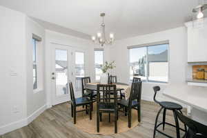 Dining area featuring a chandelier and light hardwood / wood-style flooring