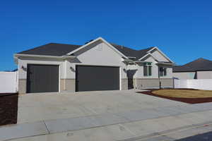 View of front of property featuring a garage
