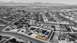 Birds eye view of property with a mountain view