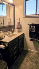 Bathroom featuring vanity and plenty of natural light