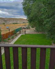 View of yard with a rural view