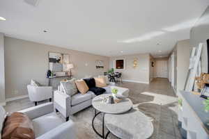 Living room featuring light tile patterned floors