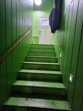 Staircase with wood walls