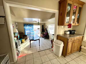 Living room with light tile patterned flooring