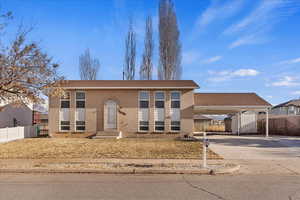 View of front of property with a carport