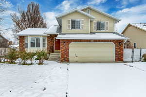 Split level home featuring a garage