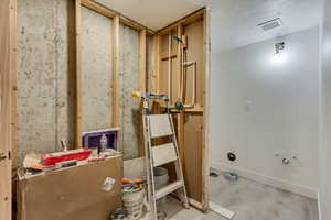 Bathroom featuring concrete floors