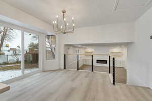 Interior space featuring light hardwood / wood-style floors and an inviting chandelier