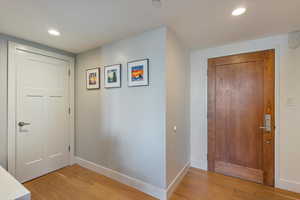 Foyer featuring light wood-type flooring