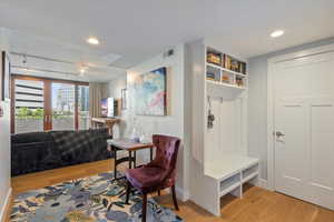 Mudroom with light hardwood / wood-style floors