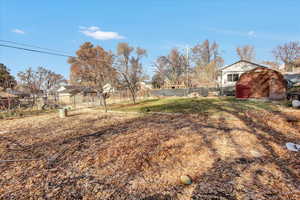 View of yard with a storage shed