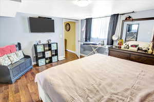 Bedroom featuring dark hardwood / wood-style flooring