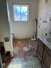 Bathroom featuring vanity and laundry area