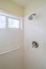 Bathroom with walk in cultured marble shower