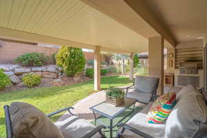 View of expanded patio / terrace featuring outdoor lounge area, an outdoor kitchen, and a grill