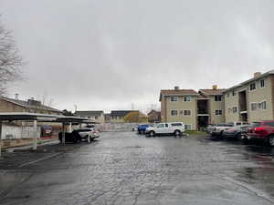 View of car parking featuring a carport