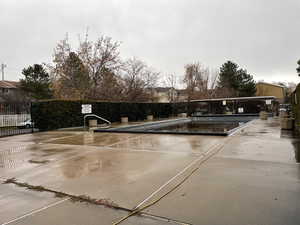 View of sport court with a community pool