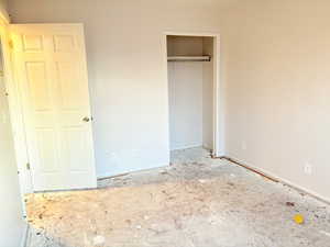 Unfurnished bedroom featuring a closet