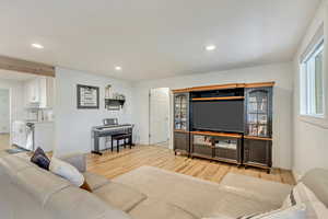 Living room featuring sink and light wood-type flooring