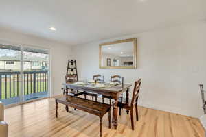 Dining room with light hardwood / wood-style floors