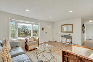 Living room with light wood-type flooring