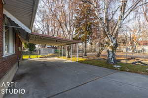 View of patio featuring a carport