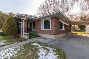 View of front of house featuring a carport