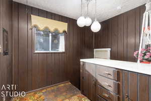 Dining area with wood walls