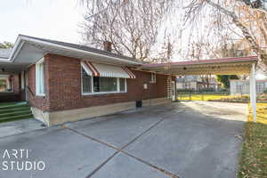 View of home's exterior with a carport