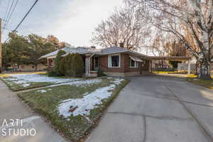 View of front of house featuring a carport