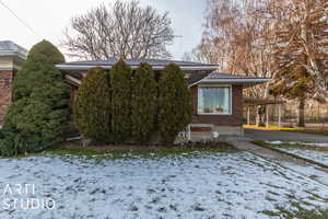 View of front of home with a carport