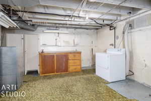 Basement with washer / clothes dryer