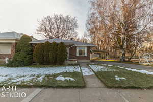 View of front of property featuring a carport