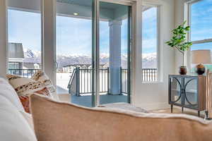 Living area featuring a mountain view and baseboards