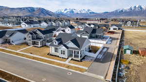 Aerial perspective of suburban area with a mountainous background