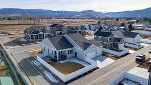 Aerial view of residential area featuring a mountainous background