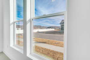 Detailed view of baseboards and carpet flooring