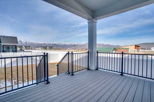 Wooden deck featuring a mountain view